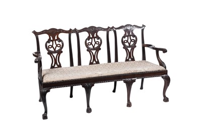 Lot 1413 - A George III style mahogany triple chair back settle