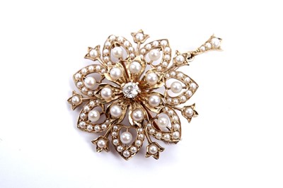 Lot 616 - An Edwardian seed pearl and diamond snowflake brooch/pendant