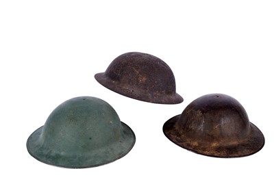 Lot 191 - Two Brodie helmets; and another