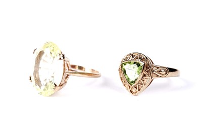 Lot 1 - A peridot dress ring; and another