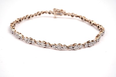 Lot 617 - A diamond line bracelet