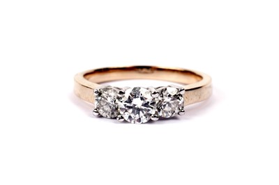 Lot 618 - A three stone diamond ring