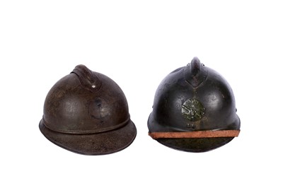 Lot 201 - Two French Adrian helmets