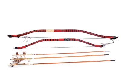 Lot 214 - Two Japanese archery bows; and three arrows