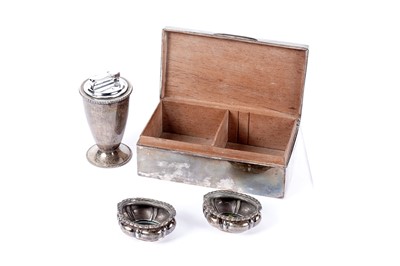 Lot 1128 - A silver mounted cigarette box; a pair of silver table salts; and a table-lighter receiver