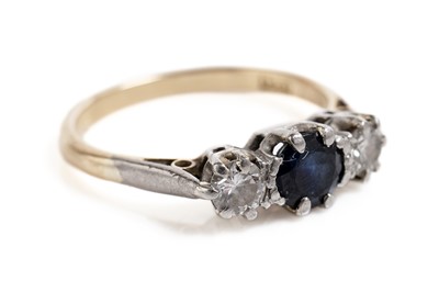 Lot 677 - A sapphire and diamond three stone ring