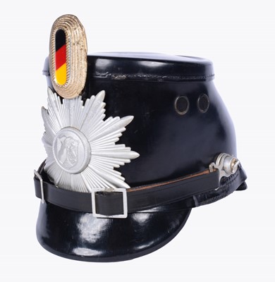 Lot 187 - A German Police shako helmet