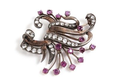 Lot 802 - A ruby and white sapphire spray brooch