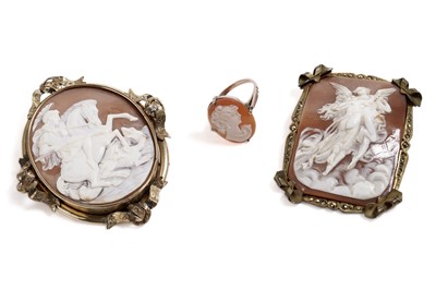 Lot 663 - A cameo dress ring; and two carved shell cameos