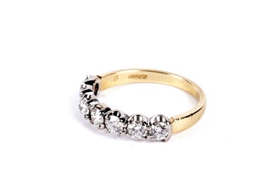 Lot 8 - A diamond half hoop eternity ring