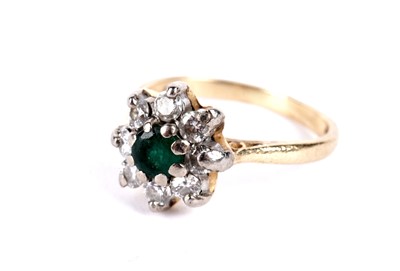 Lot 9 - An emerald and diamond cluster ring