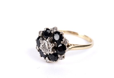 Lot 19 - A sapphire and diamond flower cluster ring