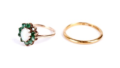 Lot 24 - A 22ct yellow gold wedding band; and an opal and emerald cluster ring