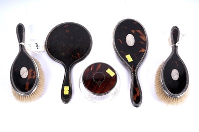 Lot 1021 - A collection of silver mounted and tortoiseshell dressing table accessories