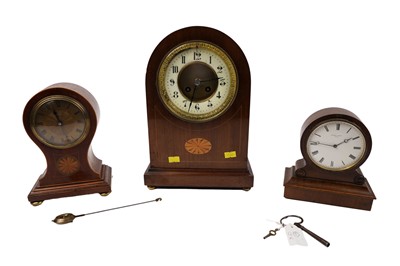 Lot 184 - An early 20th Century inlaid mahogany French mantel clock; and two others