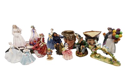 Lot 378 - A selection of decorative ceramics figures; and The Royal Doulton Figures book