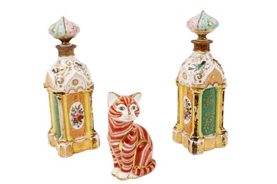 Lot 401 - A pair of 19th Century French ceramic scent bottles and stoppers; and a paperweight