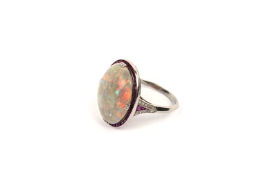 Lot 641 - An Art Deco opal, ruby and diamond dress ring