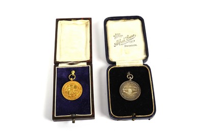 Lot 13 - A 9ct yellow gold Institute of certificated grocers medal and a silver medal