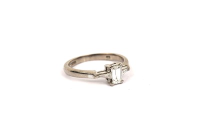 Lot 640 - A baguette cut diamond ring