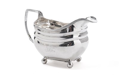 Lot 1048 - A George III silver cream jug