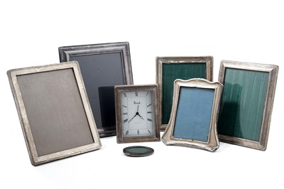 Lot 955 - A collection of silver photo frames; and a silver framed Harrods of Knightsbridge desk clock