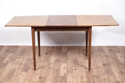 Lot 28 - A Mid Century teak extending dining table and chairs