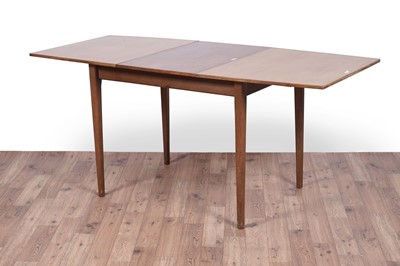Lot 28 - A Mid Century teak extending dining table and chairs