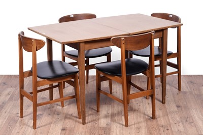 Lot 28 - A Mid Century teak extending dining table and chairs