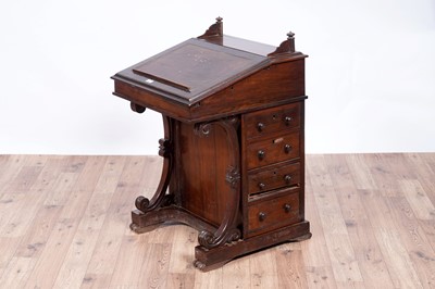 Lot 24 - A Victorian rosewood davenport and a blanket box