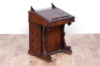 Lot 24 - A Victorian rosewood davenport and a blanket box