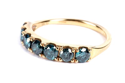 Lot 98 - A blue diamond half hoop eternity ring