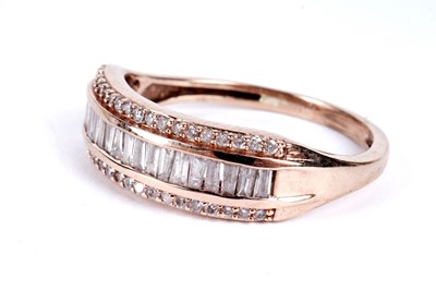 Lot 103 - A pink diamond half hoop eternity ring