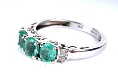 Lot 105 - A Colombian emerald and diamond ring