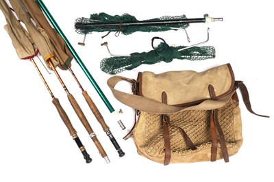 Lot 1900 - A canvas fishing tackle bag containing split cane rods; and a landing net