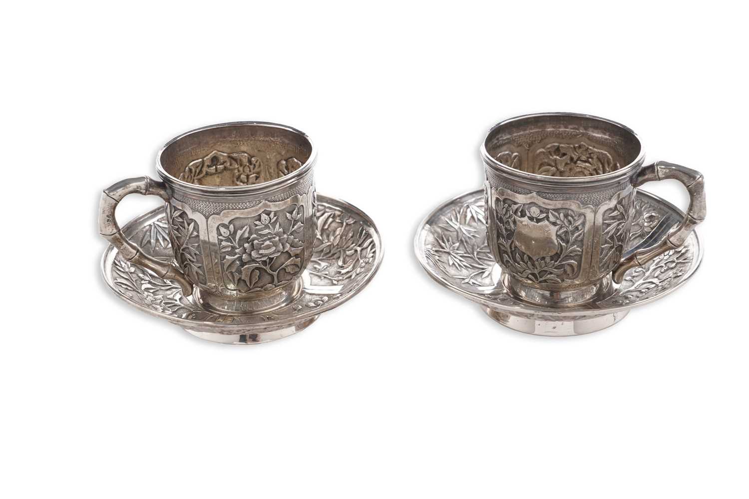 Lot 65 - A pair of Chinese silver cups and saucers