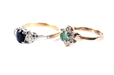 Lot 239 - A sapphire and diamond ring; and an emerald and diamond cluster ring