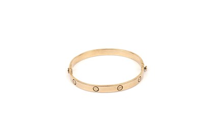 Lot 803 - A 9ct yellow gold Cartier style Love bangle