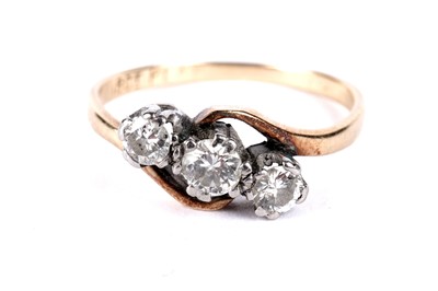 Lot 769 - A diamond three stone ring; and a wedding band