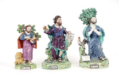 Lot 984 - Three early 19th Century Staffordshire figures of apostles