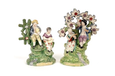 Lot 990 - Two pearlware 'Village Group' figures