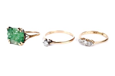 Lot 257 - Two diamond rings; and a jade ring