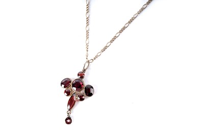 Lot 263 - An Edwardian garnet pendant