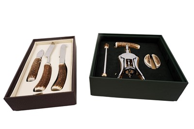 Lot 432 - A Lorenzi Milano cased simulated antler wine set; and a cheese knife set