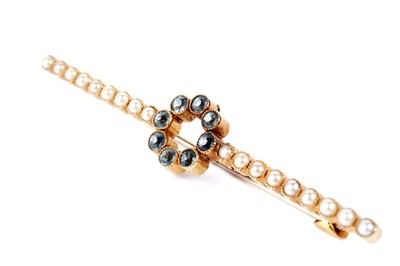 Lot 285 - An Edwardian aquamarine and seed pearl bar brooch