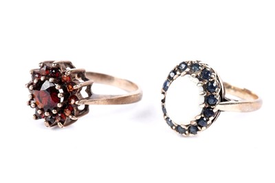 Lot 296 - A garnet cluster ring; and an opal and blue spinel cluster ring