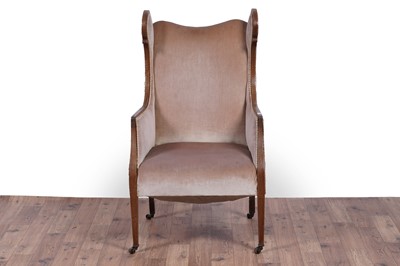 Lot 63 - An Edwardian inlaid mahogany wingback armchair