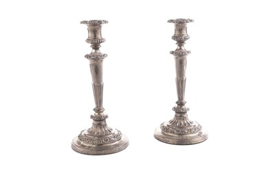 Lot 114 - A pair of late George III silver candlesticks