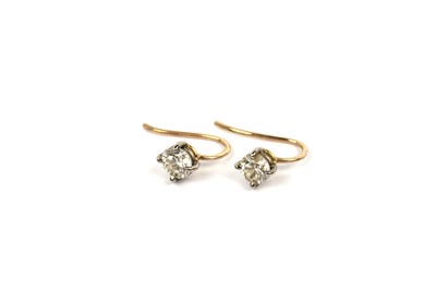 Lot 650 - A pair of diamond earrings