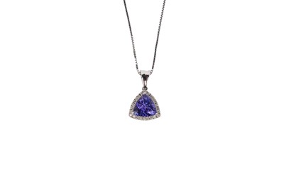 Lot 687 - A tanzanite and diamond cluster pendant